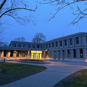Building at night, entry area brightly lit up