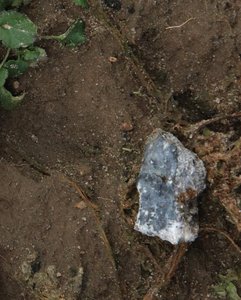 Meteorite fragment lying on earth